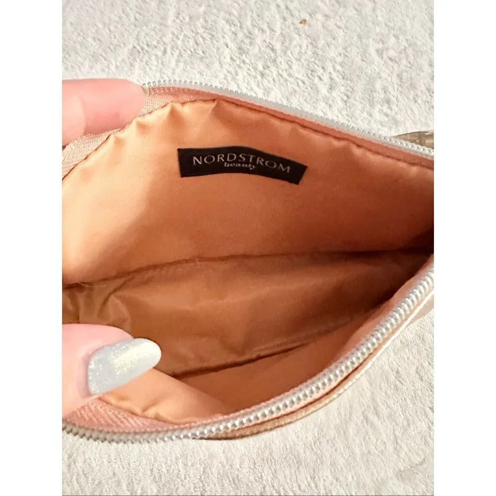 Nordstrom‘s Rose gold cosmetic bag with tassel